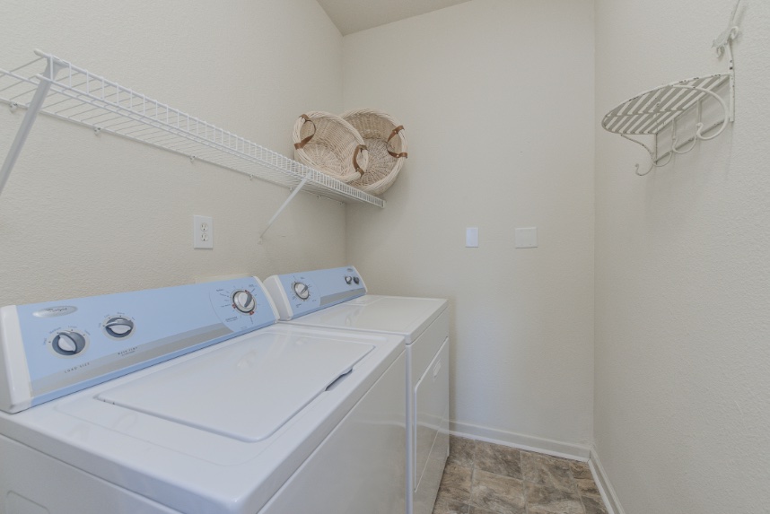 Laundry room with storage space in Brownsburg.